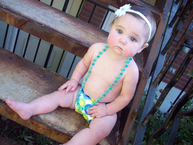 Wearing one of her new cloth diapers.