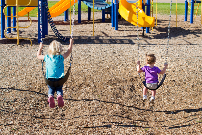 Swinging with her cousin