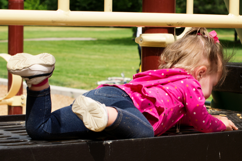 Scooting along on her belly across the bridge