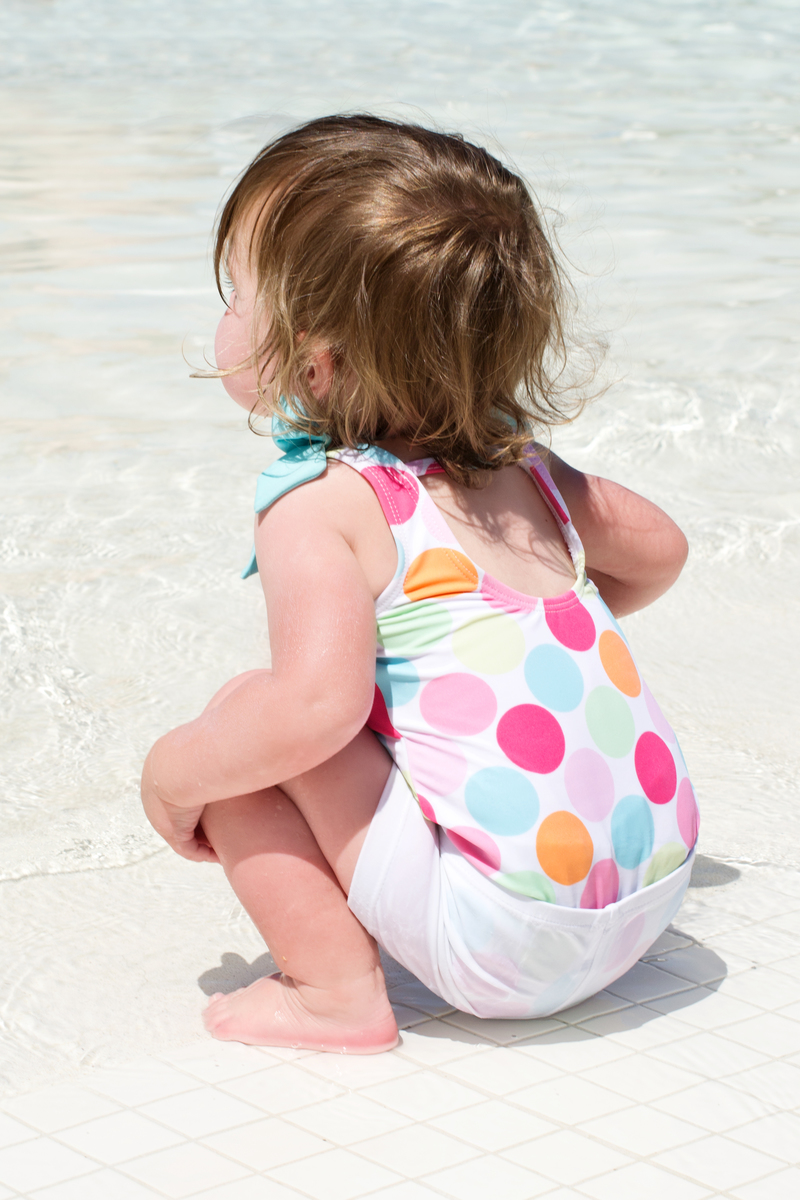 She starts out by squatting next to the water to observe it