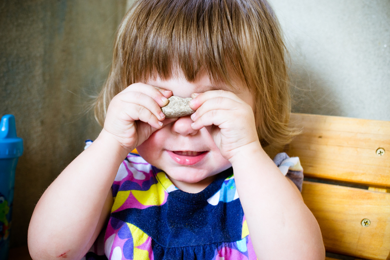 She held this rock up to her eyes and said "Cheese!"