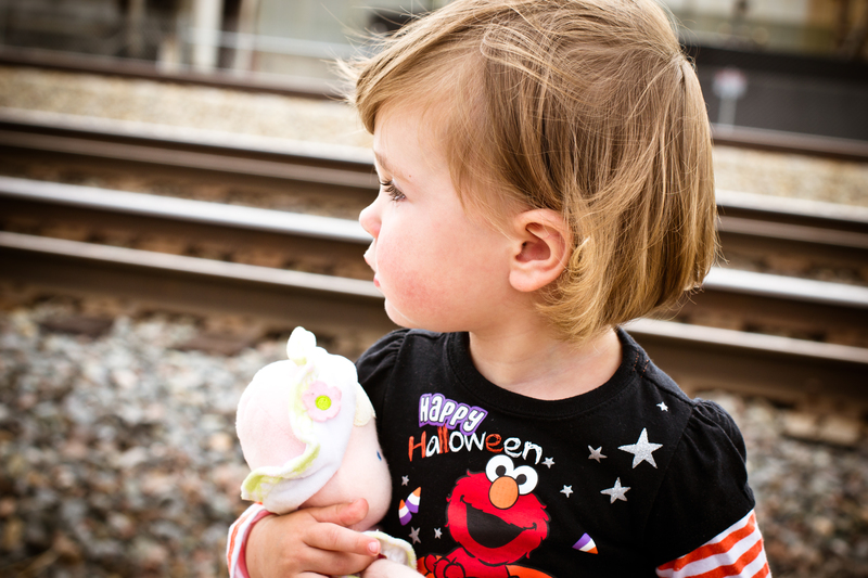 Sitting by the train tracks waiting for a train to come by