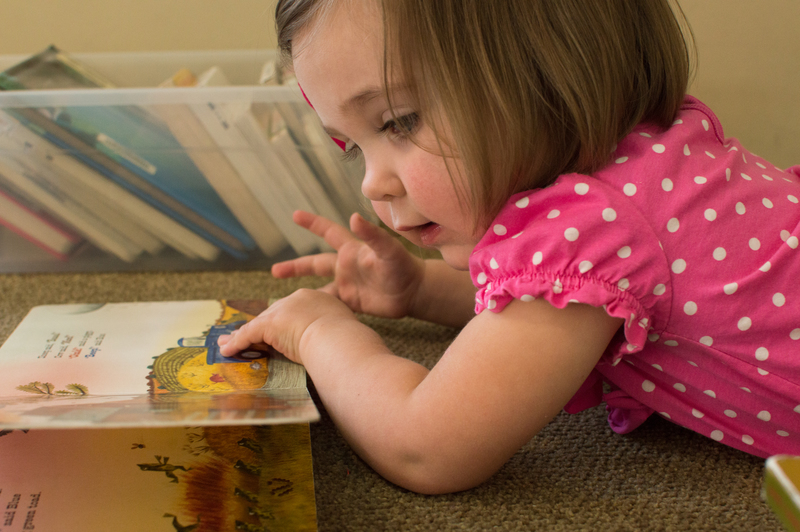 Em sure loves her books!