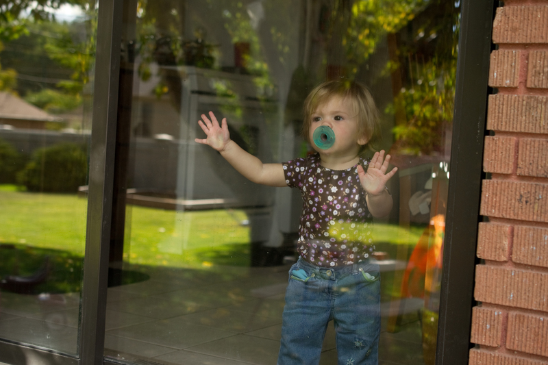 Wishing she could play outside...