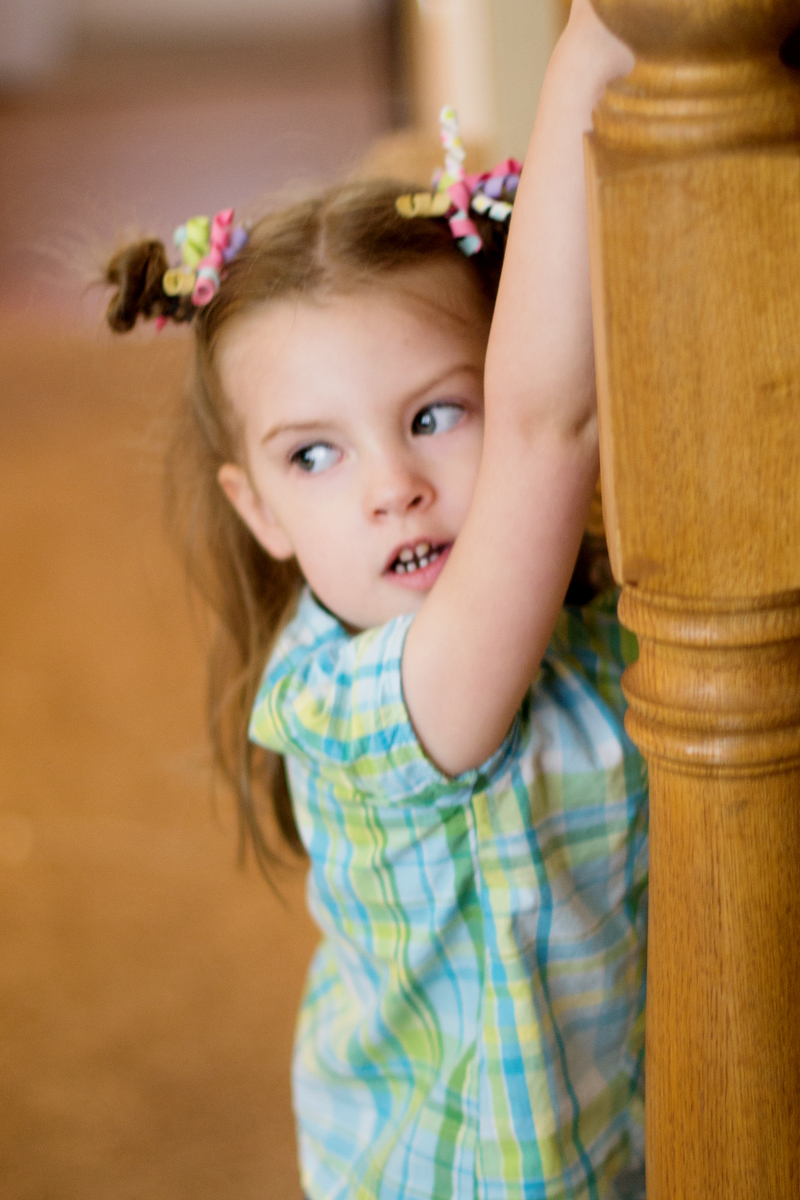 Hanging off the banister