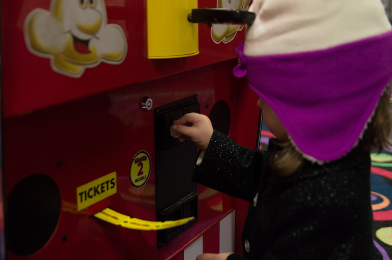 Em also liked putting in the coins "all by myself"