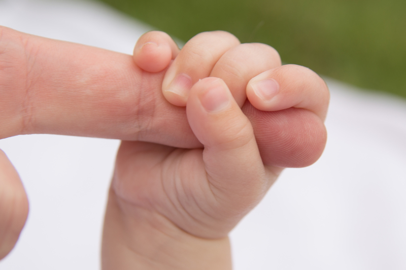 Holding Auntie Stacia's stubby little finger