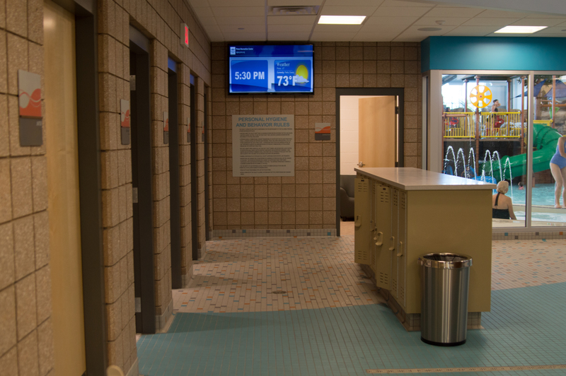 Walking into the family locker lounge. A dozen or so doors lead off this lounge area. Each one has a family bathroom/shower/changing area