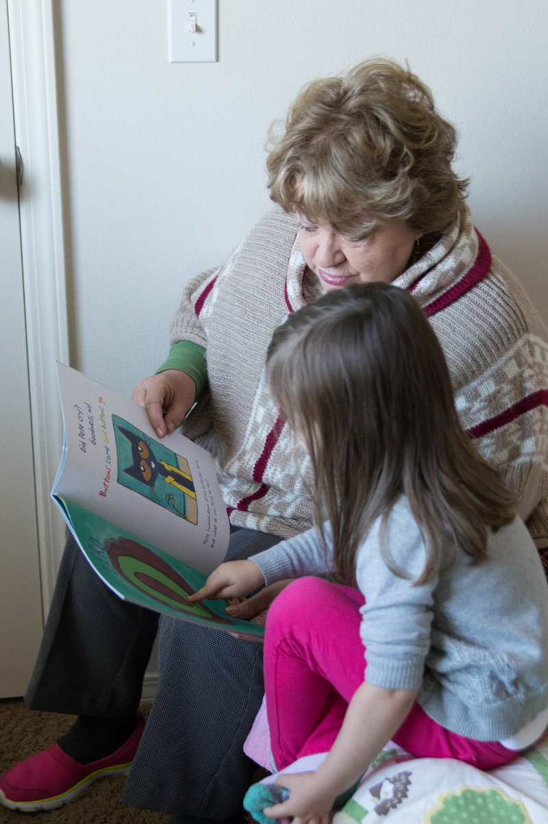 Looking at a book Em got