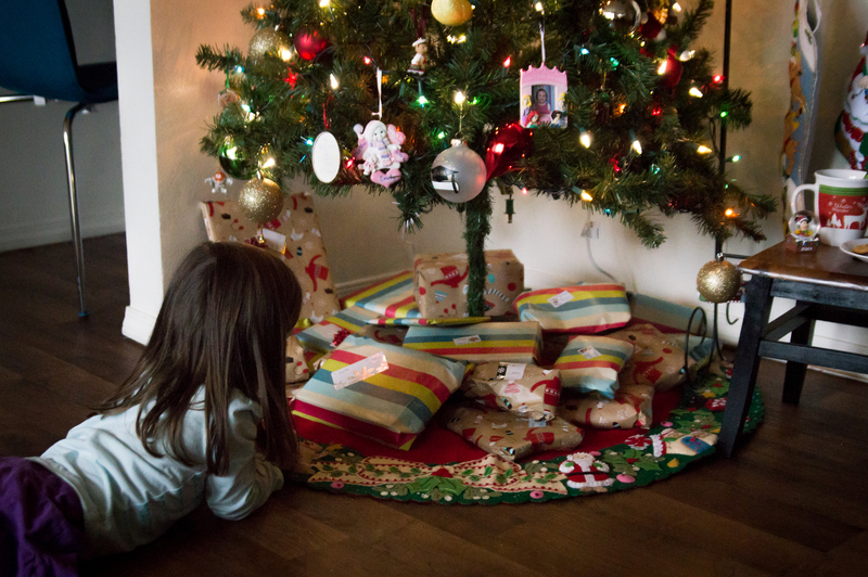 Checking out the presents already under the tree