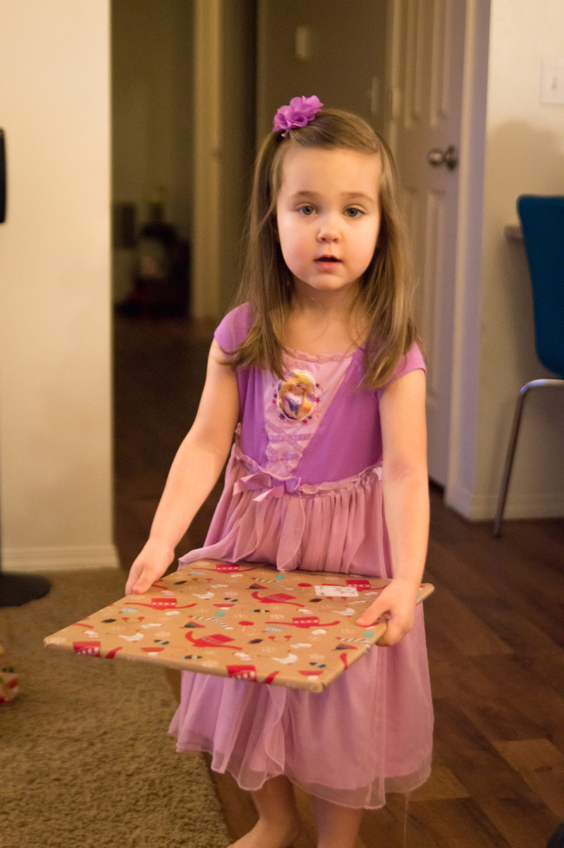 Em begins passing out presents