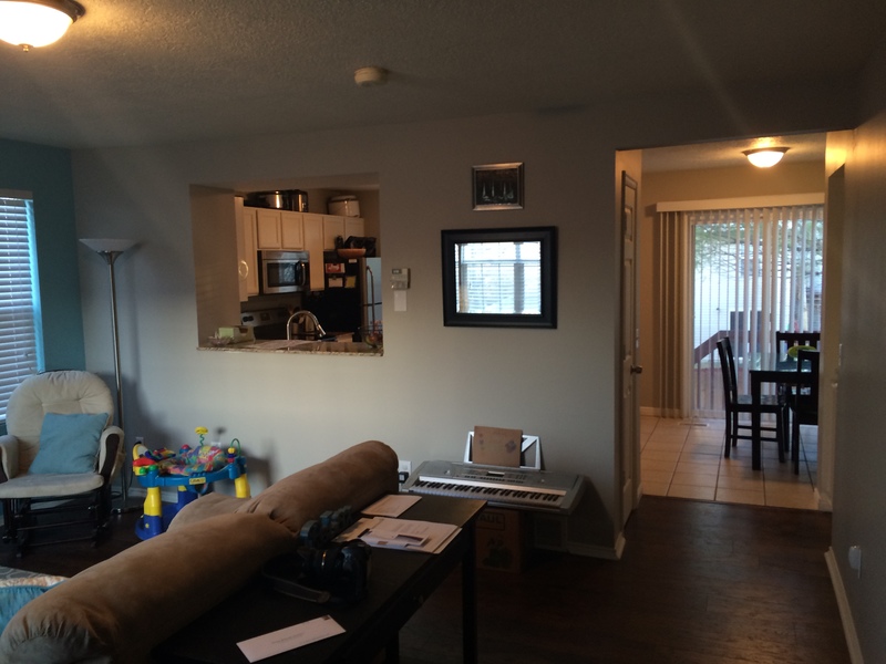 Living room, view of kitchen and dining room