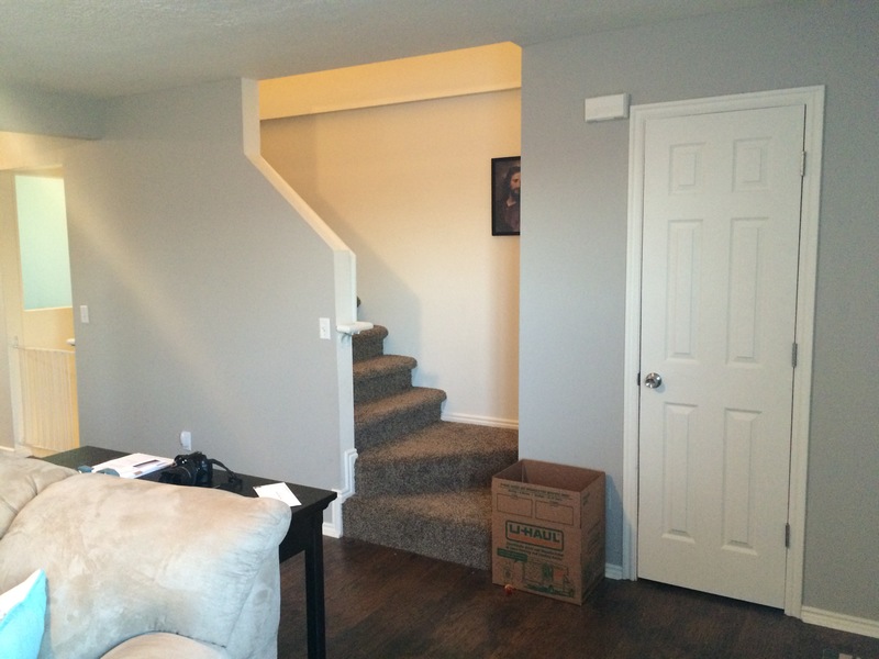 Living room, coat closet and stairs up