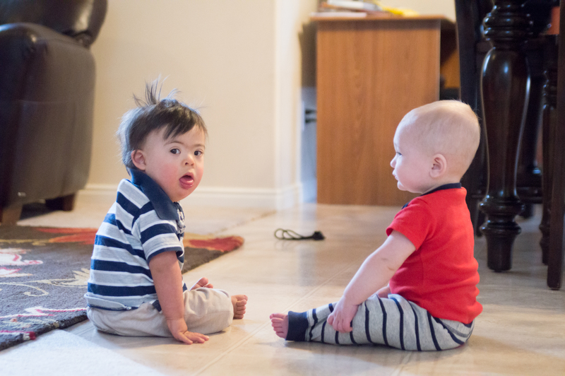 You want us to play together? We're babies!